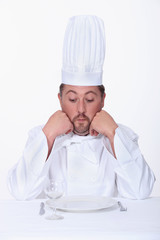 Male chef looks very unhappy