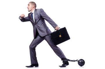 Businessman with shackles on white