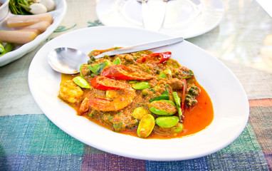 prawn in spicy curry on white plate
