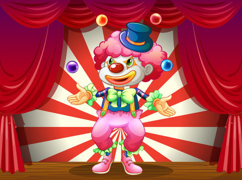 A clown at the center of the stage