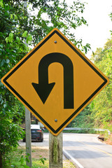 U-turn symbol Road in rustic city in Thailand