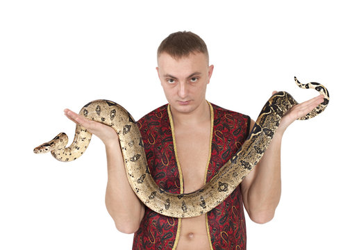 Portrait of man with boa snake