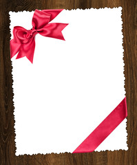 blank paper sheet with red bow