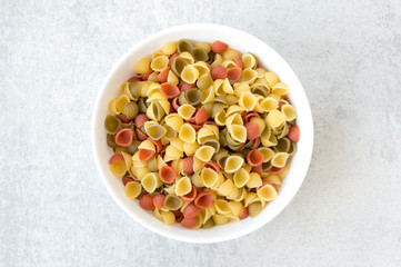 Bowl of uncooked macaroni shells