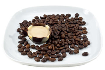 Coffee beans and  chocolate cup with coffee cream