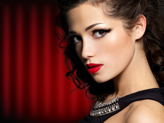 Beautiful face of brunette woman with red lips