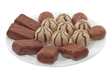 Chocolates on the plate isolated
