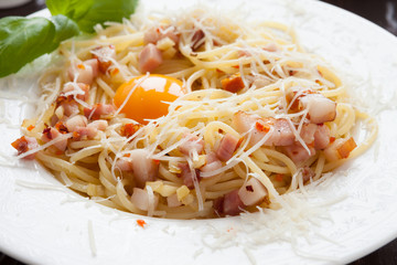 Spaghetti carbonara with yolk and parmesan cheese