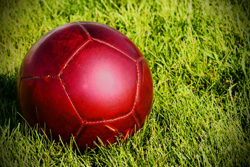 Fototapeta na wymiar Red soccer ball
