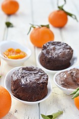 Chocolate mud cakes with chocolate and mandarin ice-cream