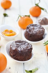 Chocolate mud cakes with chocolate and mandarin ice-cream
