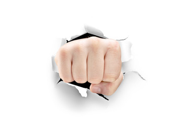 Male fist breaking through a white paper