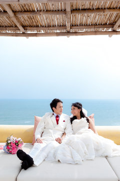 In love bride and groom are posing in romantic emotion