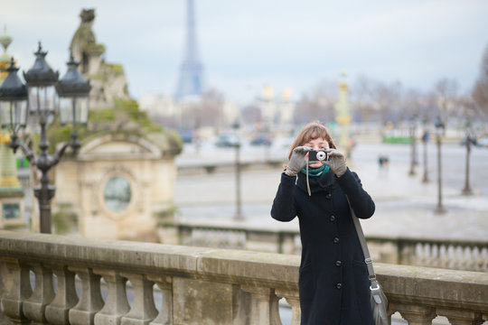Tourist in Paris taking a picture