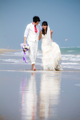 Fototapeta na wymiar In love bride and groom are posing in romantic emotion