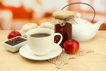 light breakfast with tea and homemade jam, on wooden table