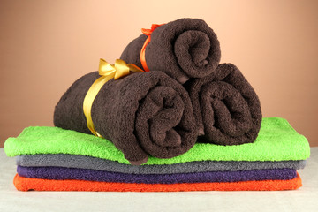 Obraz na płótnie Canvas Colorful towels, on brown background