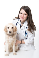Obraz na płótnie Canvas Young Veterinarian Embracing Beautiful Dog