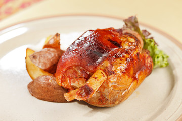 roasted pork knuckle with potatoes