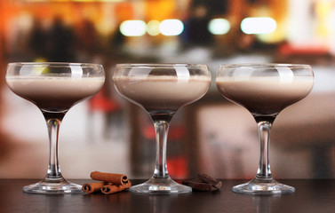 Cream cocktails on table in cafe