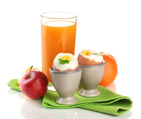 Light breakfast with boiled eggs and glass of juice, isolated