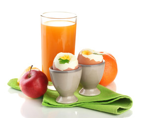 Light breakfast with boiled eggs and glass of juice, isolated