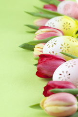 Obraz na płótnie Canvas Flowery Easter eggs and tulips border