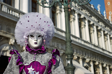 Venetian costume attends Carnival of Venice. © Lovrencg