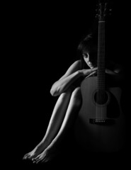 Classic Black and White Art of Woman's body with Guitar
