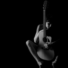 Classic Black and White Art of Woman's body with Guitar