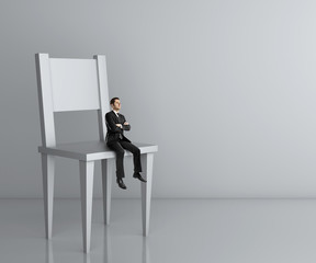 man sitting a big chair