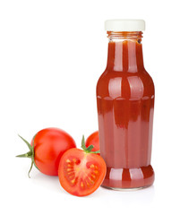 Tomato ketchup bottle and ripe tomatoes