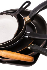 heap of kitchen bakeware with pan and pot