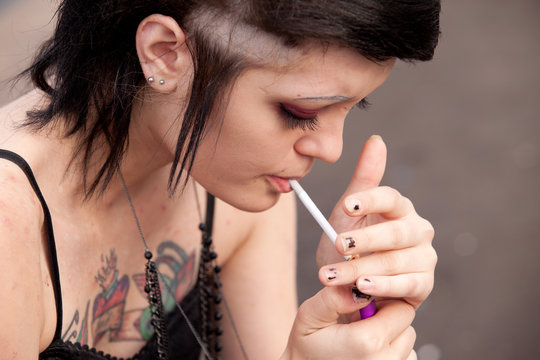punk girl smokes a cigarette