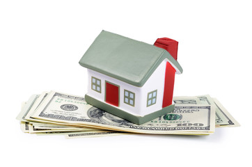toy house for dollar banknotes as a background