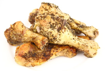Roasted chicken legs on the white plate