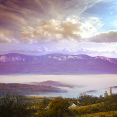 mountians village under fog