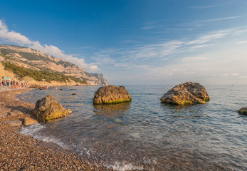 Beach between rocks and sea. Black Sea, Ukraine.