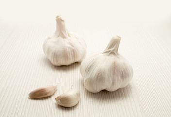 two garlic close up and wood background