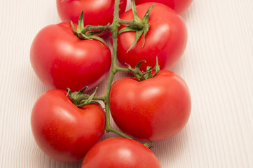 vine tomatoes on a table with close up