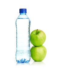 Bottle of sparkling water and green apple