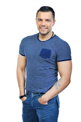 Fototapeta premium Handsome man casually posing with hands in a pockets