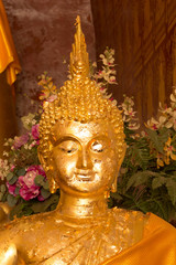Golden Buddha image in church of Buddhist temple in Thailand