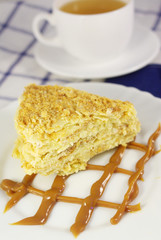 Cake Napoleon with sour cream on a plate