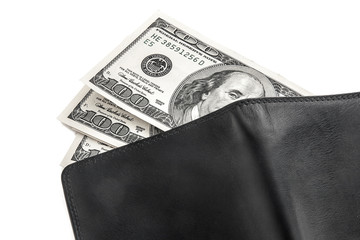 US dollars in a black wallet isolated on white