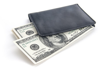 US dollars in a black wallet isolated on white