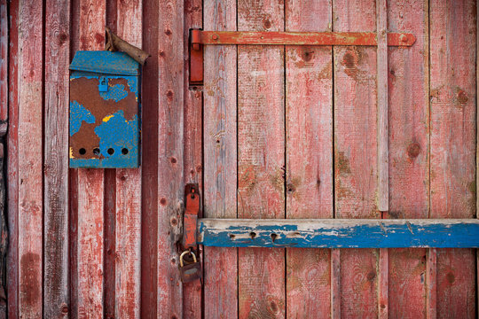 old mailboxe on an old wooden door