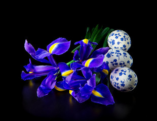 three Easter eggs with bouquet of iris