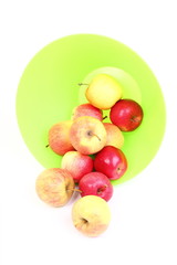 Fresh green, red apples in basket isolated