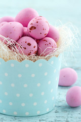 Pink easter eggs in a cupcake cup